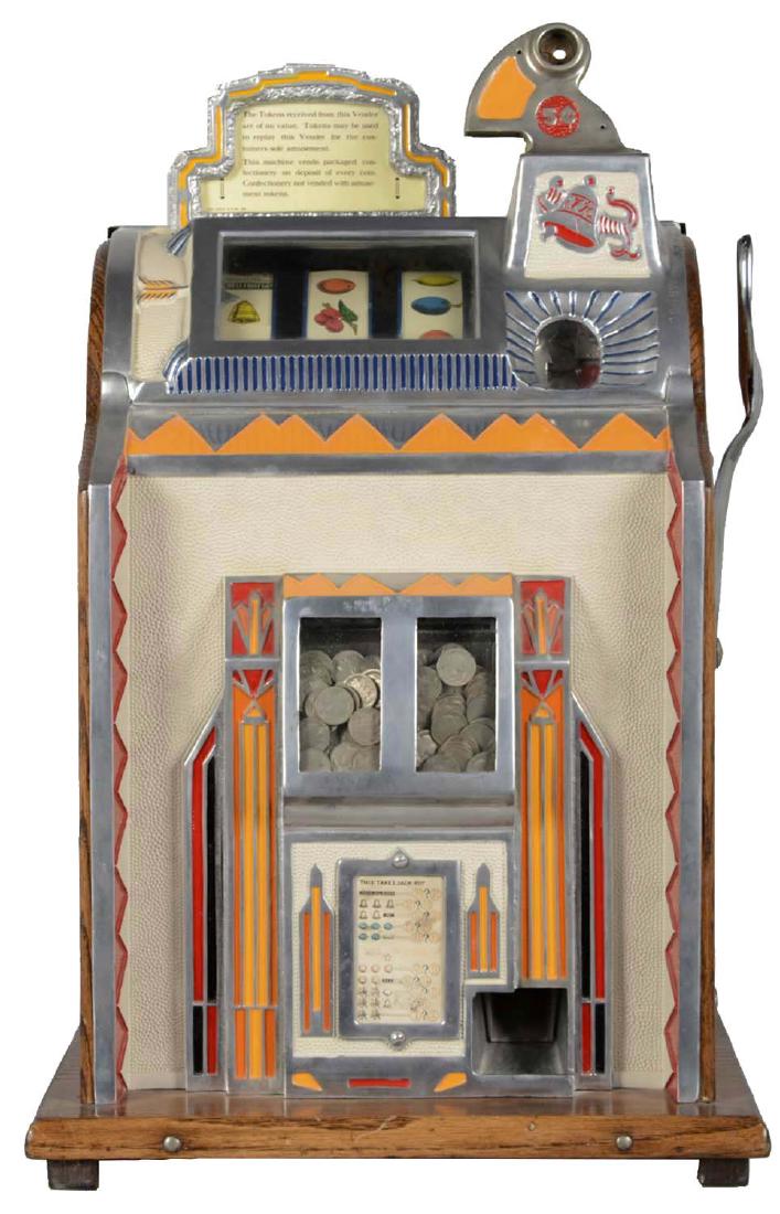 **5¢ Mills Twin Jackpot Revamp Gooseneck Bell Slot: The Mills Novelty Co. released this machine in 1933. The top sign indicates that the machine will only dispense tokens and refers to it as a vender. Instead of tokens, the visible twin jackpots are fu
