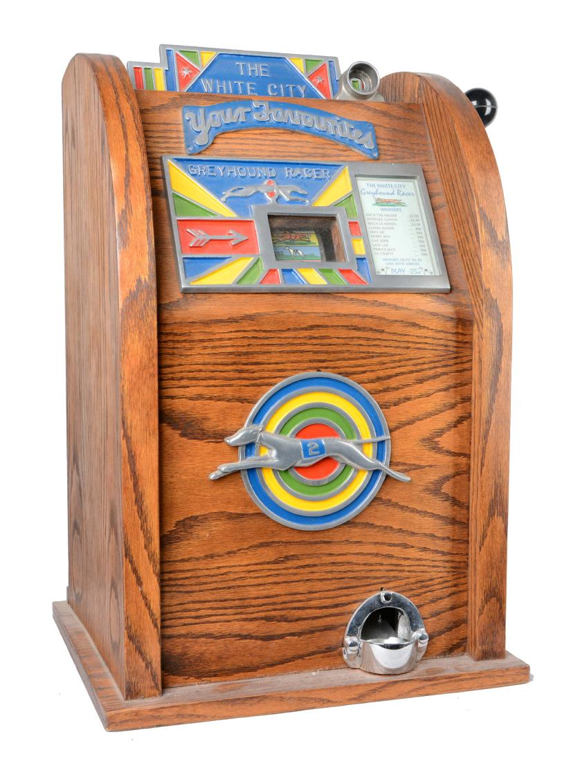 **25¢ Tom Boland & Co. Revamp White City Greyhound: Single-reel slot machine with wooden cabinet and central greyhound dog emblem. The coin chute is sized for English pennies yet accepts and functions with U.S. quarters. Circa 1950. Includes 1 key. (Ex