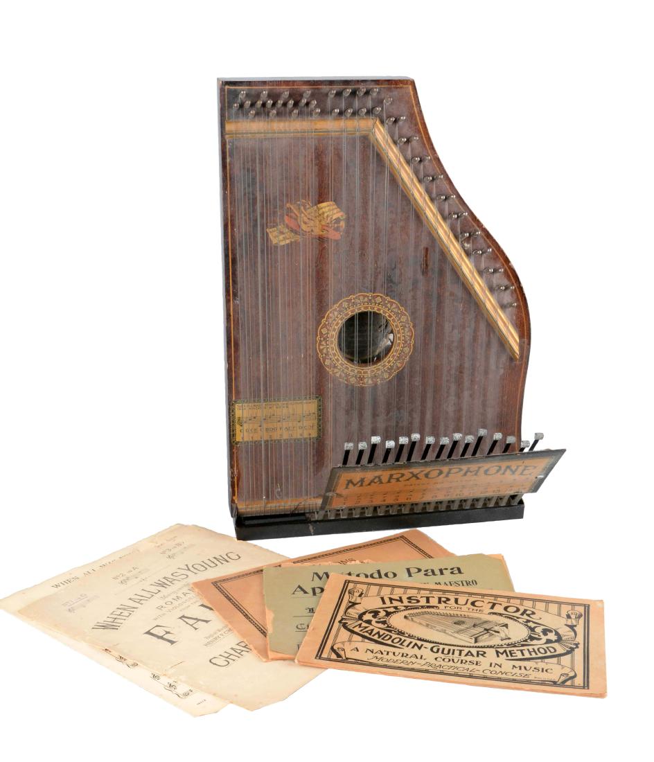 Marxophone: Developed by Henry Charles Marx in 1912, this Marxophone was built sometime between 1926 and the 1950's in Hoboken, New Jersey. Also included are some instruction booklets and some sheet music. It sho