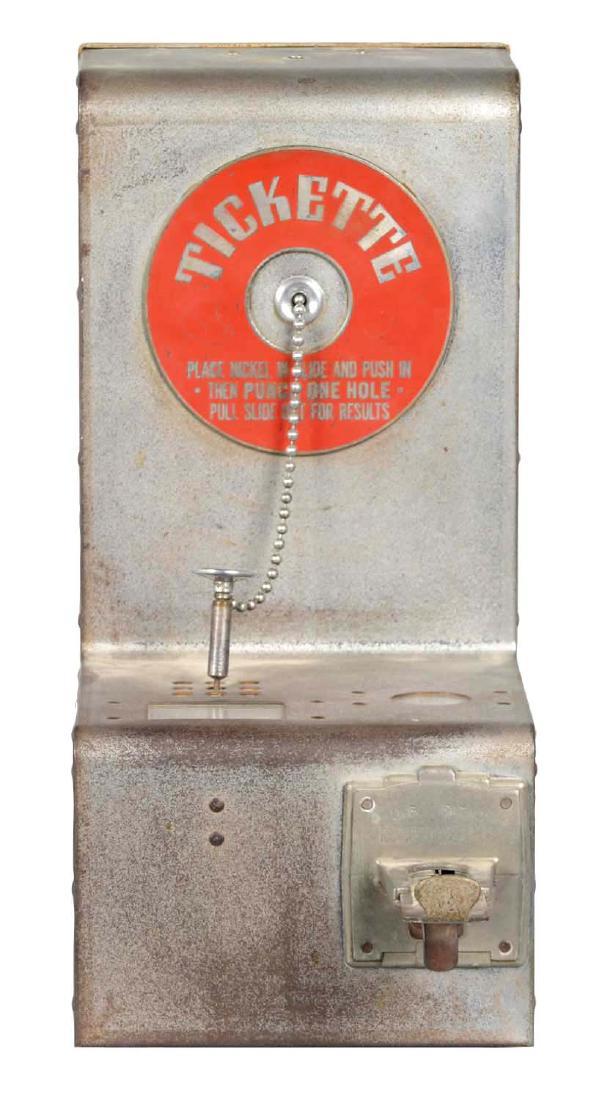 **5¢ Mills Novelty Tickette Hole-Punch Trade Stimulator: Players place a nickel in the slide and then push it in. Then they would use the attached hole punch to poke into one of the nine holes, and move the coin slide out to see their results. Includes tick