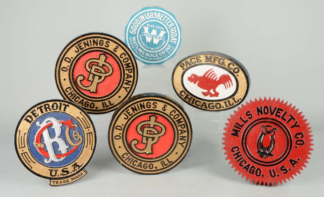 Lot Of 6: Wood Slot Machine Manufacturer Logo Signs: Including 1 - Caille Bros. Co. Detroit, 1 - Mills Novelty Co. Chicago, 1 - Pace Mfg. Co., 1 - Watling Scale Co. Inc. and 2 - O.D. Jennings & Co. Chicago. These signs are hand painted and ready for dis