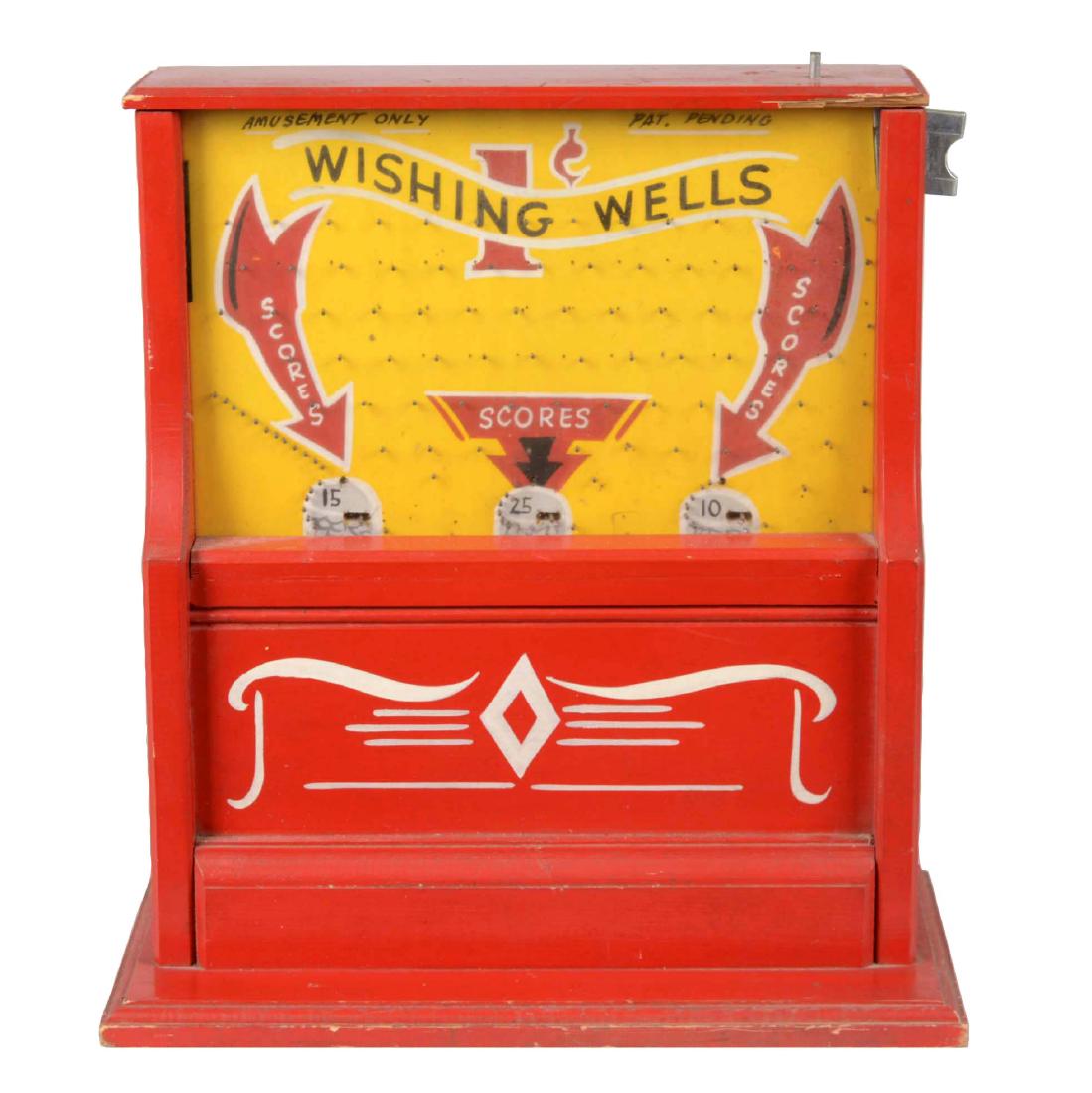 1¢ Skipper "Wishing Wells" Countertop Pin Field Game: Skipper Sales Co. made this penny flipping game in 1923. The graphics in the pin field are hand painted on wood. Includes key. (Very Good). 17" T. x 15" W. x 8-3/4" D.