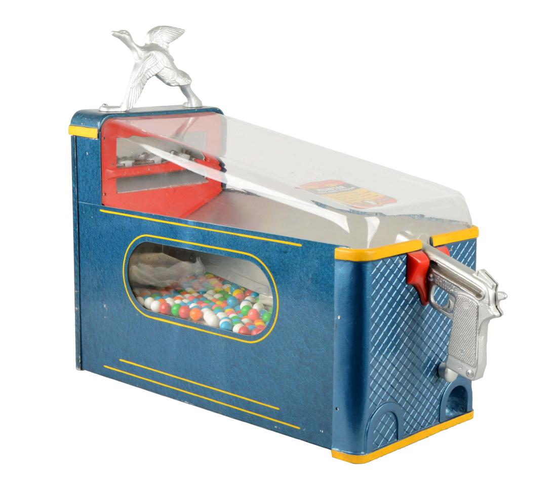 1¢ Silver King Duck Shoot Hunter Pistol Game: Metal cabinet features curved plastic top globe with flying duck marquee and visible gum balls below. In working condition. Showing minor paint loss. Includes key. Circa 1949. (Very Good). 23" x 19" x