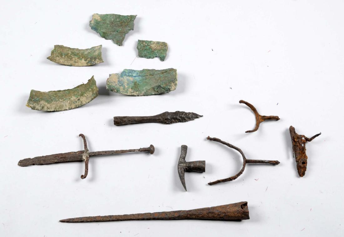 Lot of 14: Excavated Mixed Lot of Weapons.: Comprised of: 1) Ancient partial Greek bronze battle helmet. 2) 15-1/4" pike. 3) Small side knife. 4) Lance. 5) Hammer. 6 & 7) Two spurs. 8) Flintlock plate. All from different era’s. Heavy rust and