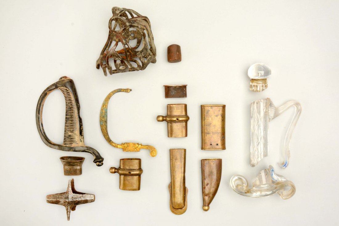 Lot of Assorted Sword Parts.: Sword elements of all kinds including hilts, mounts and cross guards. All showing various periods of age wear and patinas. Glass hilt included with this lot is broken.