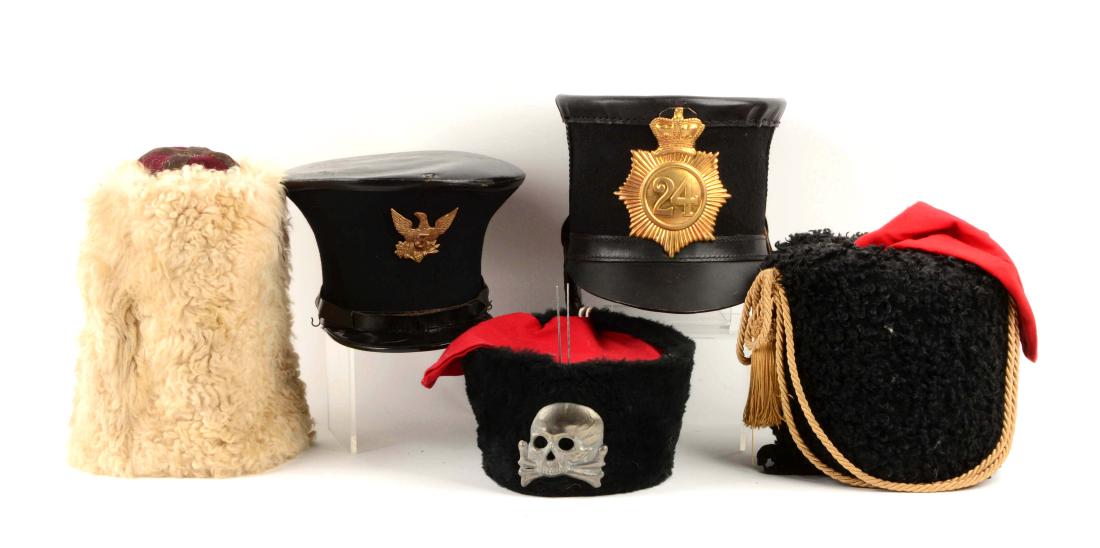 Lot Of 5: Reproduction Military Hats.: Includes a reproduction busby with faux wool and red bag, skull and crossbones on the front. Leather lining and leather string; a reproduction black bear military hat with red bag, gold bullion ropes
