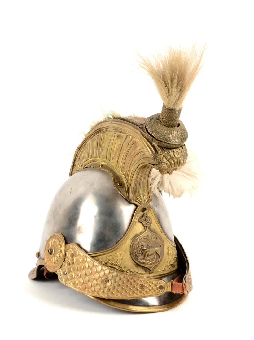 Cuirassier Style Helmet.: Crest with face, two white plumes and a plate with lion and crown. Scale chin strap, sweat band only. Chin strap is well worn, small dents with some reproduction parts.
