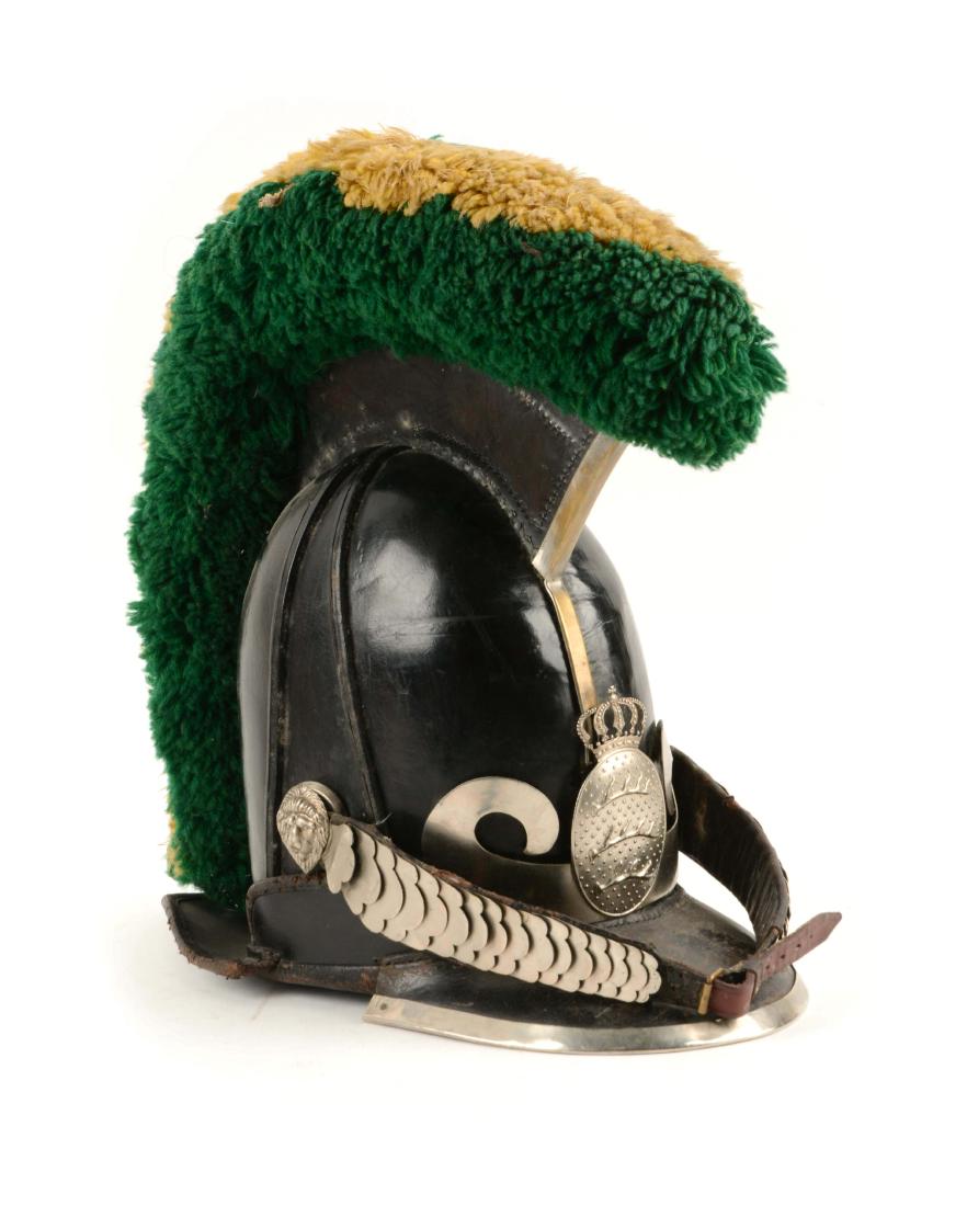 Duchy of Wurttemberg Jaeger Helmet.: Early-mid 19th century, black leather dragoon or Cuirassier style helmet, consisting of a deep leather crown with front and rear visors or flaps, the former edged with white metal. Surmounting the cro