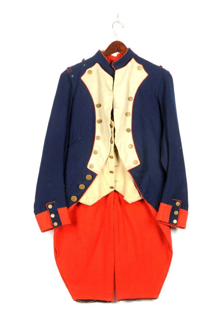 Theatrical French Napoleonic Officer's Coat and: The French officer's coat of blue wool with stand-up collar. Red wool sleeve facings, tail lining and piping. White plastron and combination waistcoat. Twelve small brass buttons on front with legend: