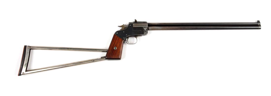 (C) Marbles Model 1921 "Game Getter" Pistol.: .22 cal over .410 with an 18" barrel. The Marble Game Getter is a light, double-barrel (over-under), combination gun manufactured by the Marble's Arms & Manufacturing Company in Gladstone, Michigan. T