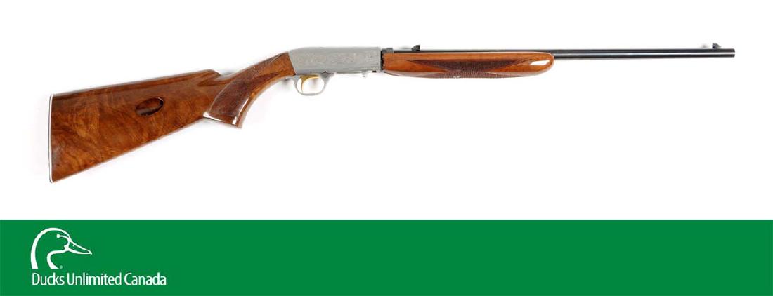 (M^) Cased Browning Grade II .22 Semi-Automatic Rifle.: The frame of this takedown rifle is in a French satin nickel with squirrels on left and right sides and a mallard on top. Japanese manufacture, 100% coverage engraving. Features high polish blue finis