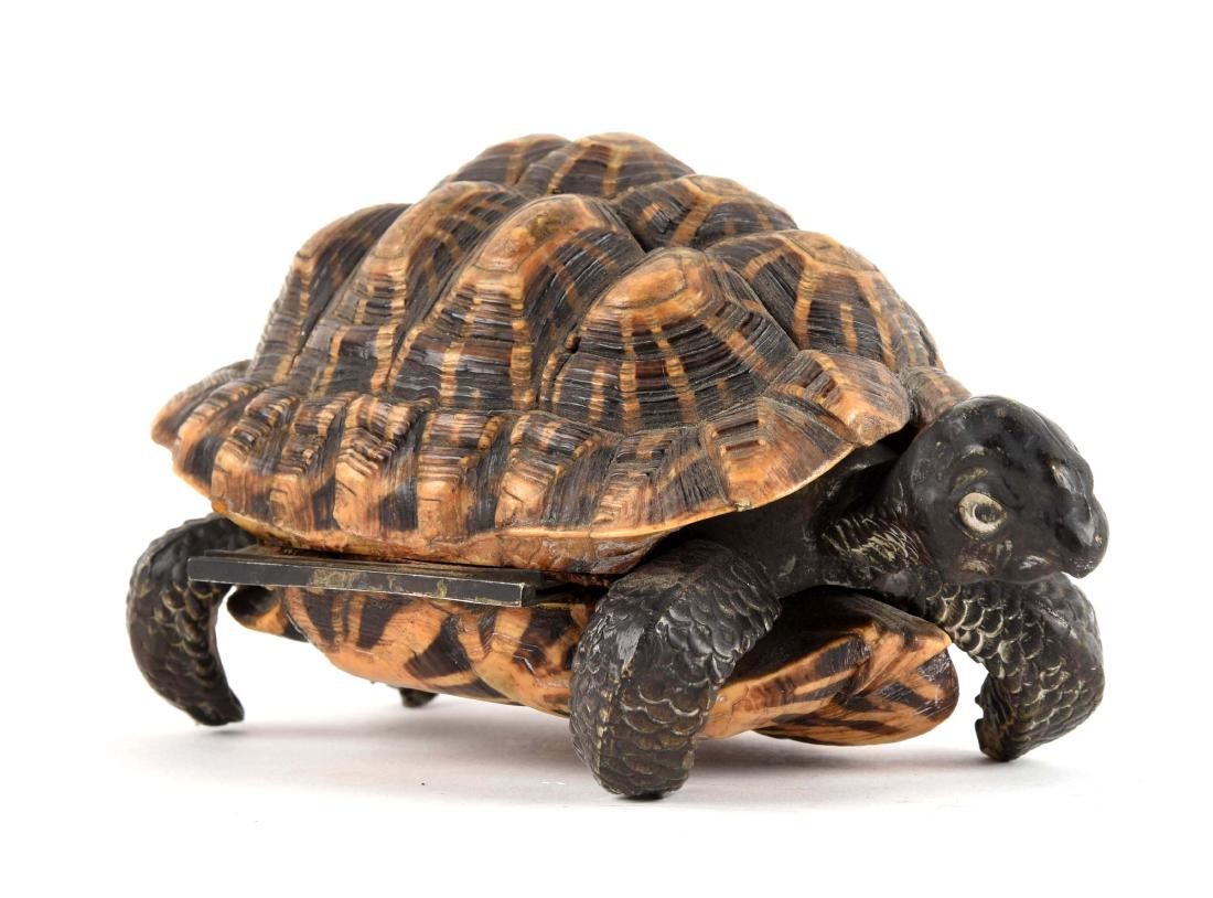 Silver Tortoise in Shell.: This is an extremely detailed figure of a turtle. The head, tail, and legs are made of silver plated steel. The top and bottom of the shell are real tortoise shell. The inside of the box is lined with