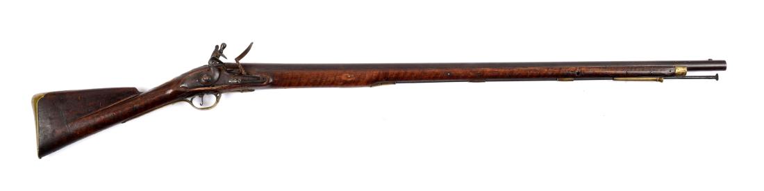 (A) British Second Model Brown Bess Musket, Probably: Pattern 1768. Round smoothbore steel barrel with bayonet lug mounted on top, near muzzle. Top marked with two Tower proofmarks, near breech. Rounded lockplate with double line border, Tang maker's mar