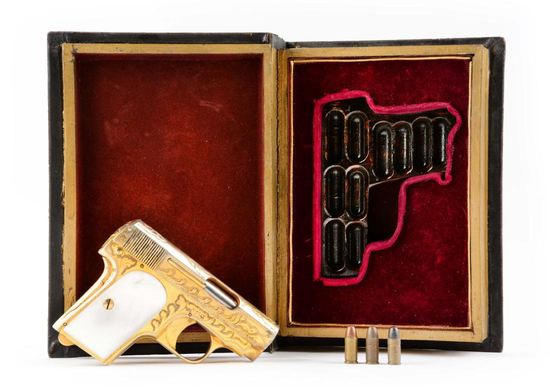 (C) Book Cased Gold Plated Engraved Astra Model: Typical Ebear pistol from the 1920's. It is based on the early FN model. Produced in Spain. Finished in gold Damascus engraved with real mother of pearl grips. Its appearance is that of an FN Model 19