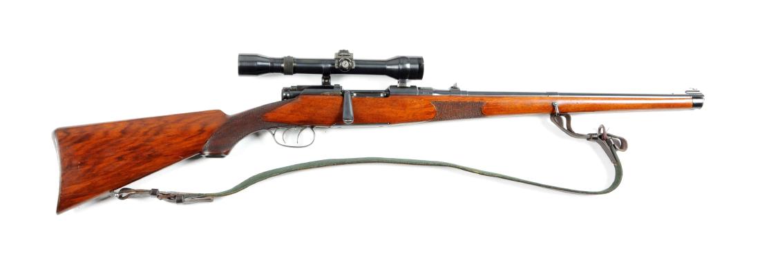 (C) Mannlicher Schoenauer Model 1908 Bolt Action Rifle.: Features round barrel, ramp front sight, butter knife bolt, folding leaf rear sight, full length checkered pistol grip walnut stock, straight comb, rollover cheek piece, trapdoor buttplate, and double