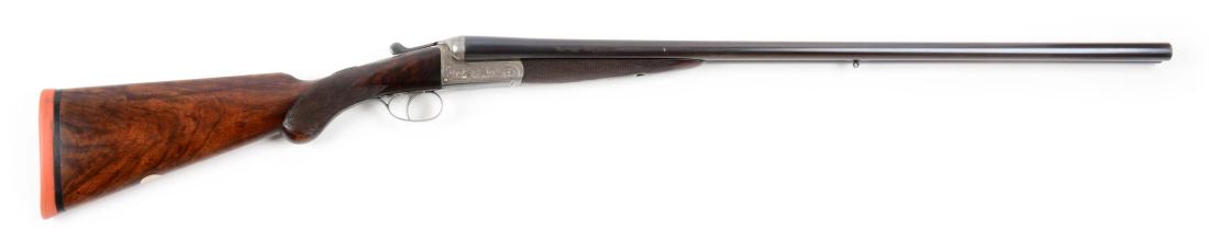 (C) Clabrough & Johnstone Boxlock Shotgun.: Round blued steel barrels with single brass bead and solid matte rib marked "CLABROUGH & JOHNSTONE MAKERS BIRMINGHAM ENGLAND". Blued and engraved lever and trigger guard, bow marked "LOVETT & RANHAM /