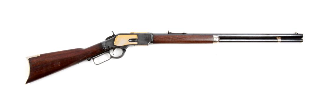 (A) Winchester Model 1873 Lever Action Rifle.: Manufactured in 1890. Standard features include round barrel, full magazine, original Winchester sporting sights, walnut stock with rifle buttplate. Strong barrel legends. Frame, barrel and tube retai