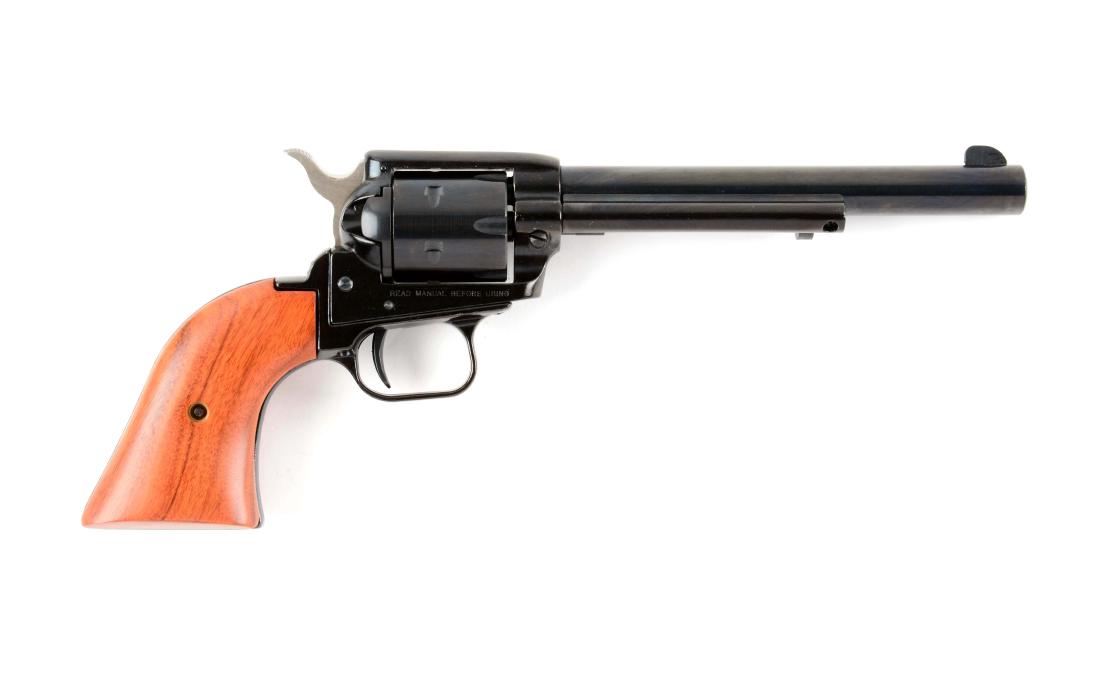 (M) Boxed NRA Heritage Firearms Rough Rider Revolver.: Features six shot, single action, blued finish, two piece wood grips with special NRA logo on left grip panel. Gun is unfired in the original box with paperwork and tools. Serial Number-E77399; Manufa
