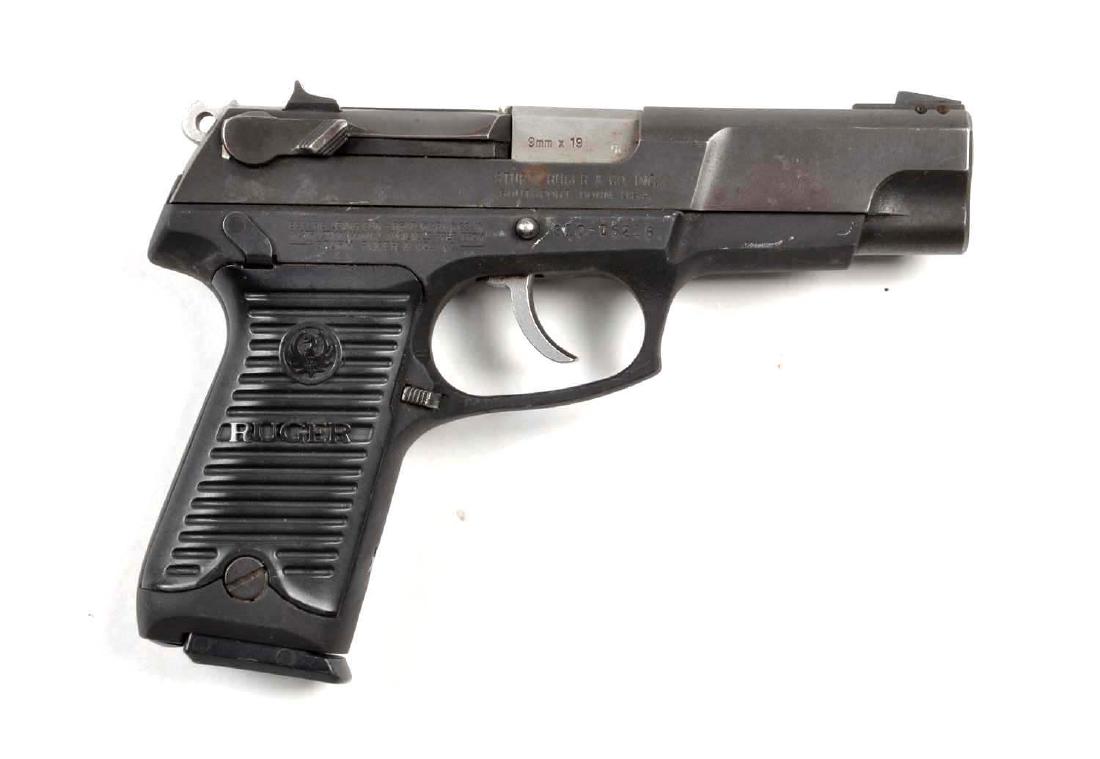 (M) Ruger Model P89 Semi-Automatic Pistol.: Chambered for the 9mm cartridge. Features a 4-1/4" barrel, matte finish, double action and plastic grips. Gun has been used. Evidence of high edge wear. Some freckling. Excellent bore and action. High
