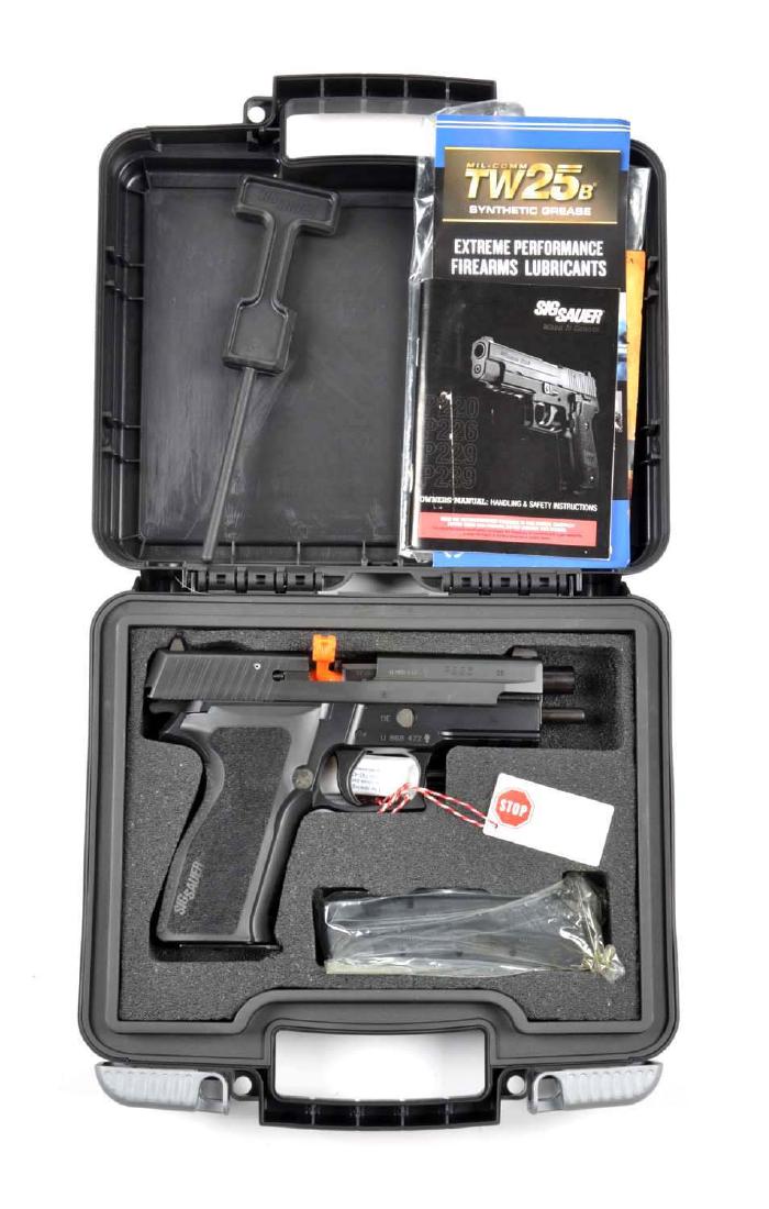 (M) MIB Sig Sauer Semi-Automatic Pistol.: This pistol is designated the Model P226 and is chambered for the 9mm cartridge. Features a 4-1/4" barrel, double action, magazine fed and semi-automatic. Manufactured in Germany. Retains all of the o