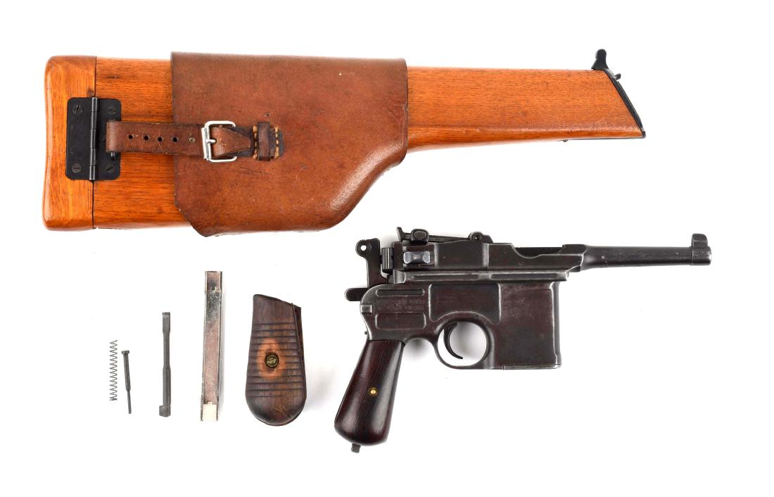 (C) Late Post-War Bolo Mauser Model 1896 Semi-Automatic: Standard post-war Bolo features blued finish, stripper clip fed, semi-automatic and grooved walnut grips. Bridge has Mauser Oberndorf stamp. Left side panel has Mauser banner. This well-used Mauser is
