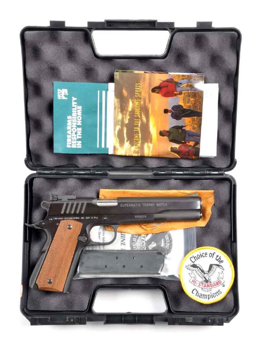 (M) MIB Hi-Standard Supermatic Trophy Match Pistol.: Manufactured by Hi Standard in Houston, Texas. It is basically a copy of the Colt Model 1911 long slide semi-automatic pistol. Chambered for the .45 ACP cartridge. Barrel measures 5-3/4". It is a semi