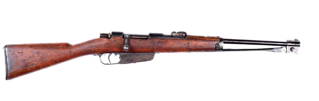 (C) Italian Carcano Carbine.: Caliber is 6.5mm. Standard World War I Italian carbine with an 18-1/2" barrel and built in folding bayonet. All metal is brown. Excellent stocks. Very good bore and action. Barrel is marked "Terni". S