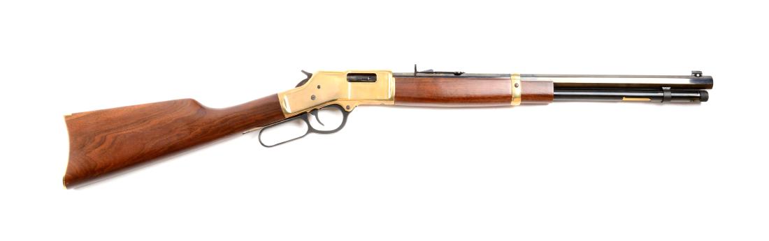 (M) Henry Lever Action .44 Magnum Rifle.: This rifle features a short, heavy full octagon barrel, full magazine, tube fed, brass frame, walnut stocks, single barrel band and brass carbine buttplate. Gun has seen little use and in near new con