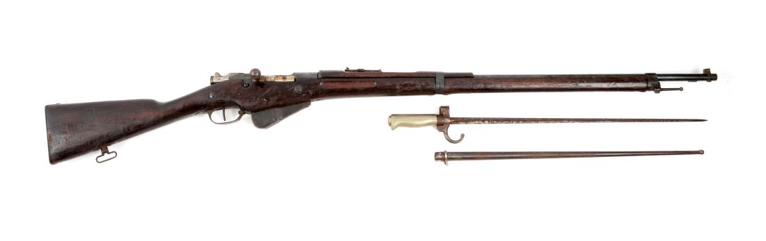 (C) Model 1916 French St. Etienne Bolt Action Rifle: Round blued steel barrel and action, marked "St Etienne MLE. M 16" on left side. Typical blued steel furniture and walnut stock with grooved forearm. Complete with bayonet. Fair condition, numbers on