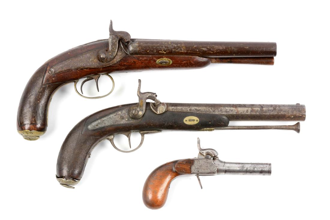 (A) Lot Of 3: Percussion Belgian Pistols.: Gun (A) is a double barrel percussion smoothbore pistol. Round smoothbore shotgun barrels with solid rib and patent breech. Back action percussion locks with scroll engraving. German silver trigger gu