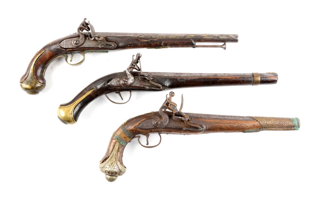 (A) Lot Of 3: Middle Eastern Flintlock Pistols.: Three flintlock pistols, two brass mounted with decorated barrels and one with silver furniture and a large cappucine near muzzle. All are in good condition, but showing heavy wear form use, scattered