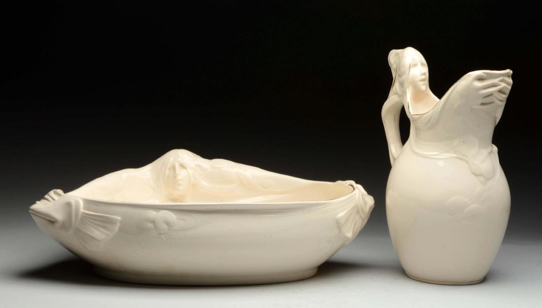 Lot Of 2:German Bowl and Pitcher By Franz Anton Mehlem.: Handle has ladies head and bowl has ladies head with handles with embossed hands. Excellent Largest: 23'' L.
