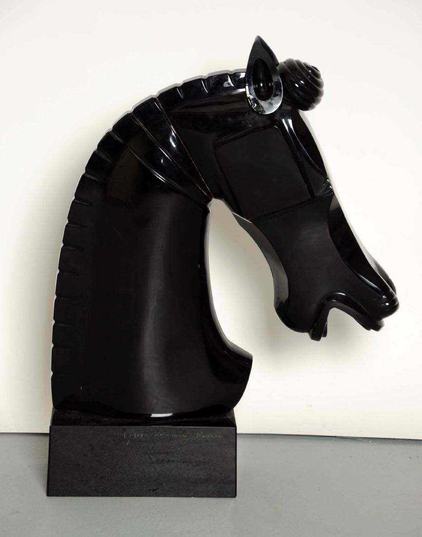 Black Murano Glass Horse Head.: This lot consists of a large beautiful black Murano horse head statue. One that is reminiscent of a chess piece, done in the art deco style with clean lines. The horse's head is situated on a black sq
