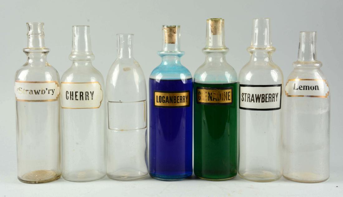 Lot Of 7: Assorted Glass Syrup Bottles. (1 of 1)