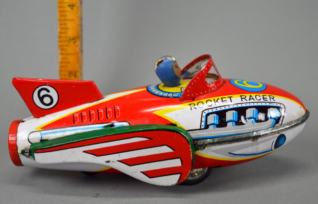 Tin Litho Rocket Racer Noisemaker Toy: Chunk missing from rubber head