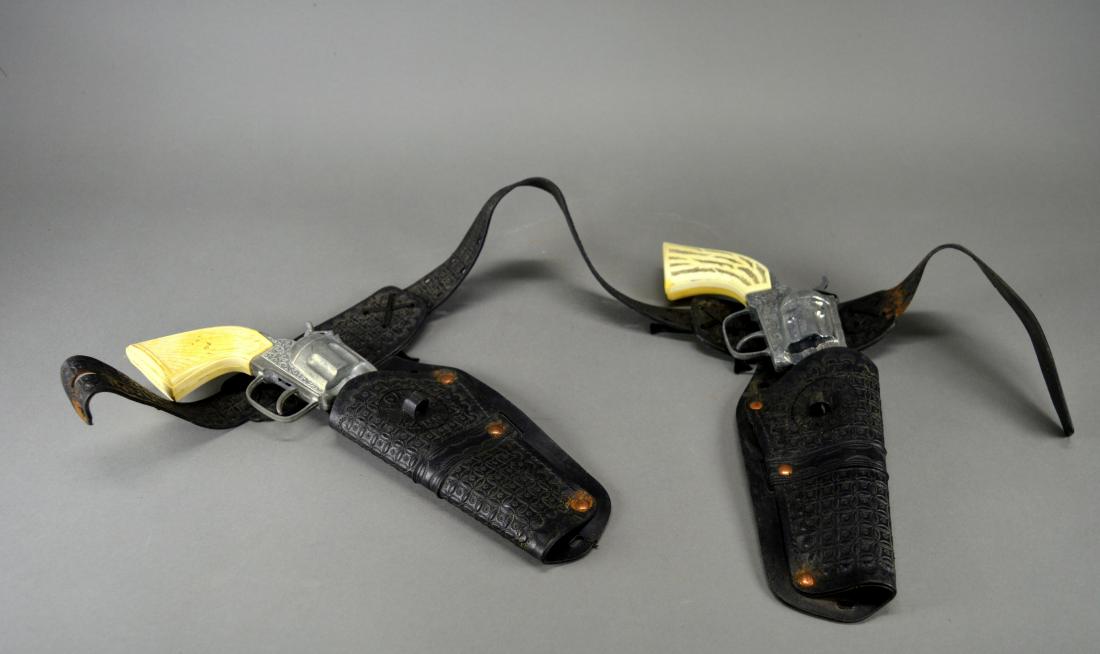 Pair Lone Ranger Cap Guns & Holsters: Finish wear and discoloration