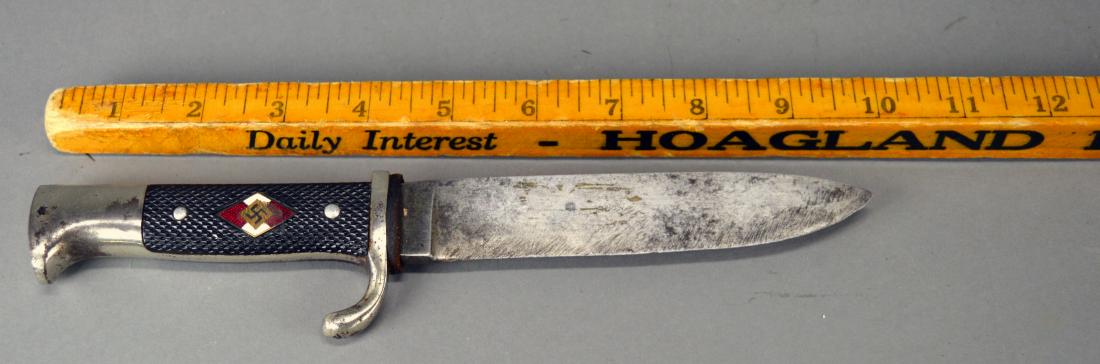 Nazi Transitional Hitler Youth knife: Made by Rob. Muller of Solingen-Merscheid. Finish wear and superficial pitting. Large abrasion to guilloche enameled emblem.