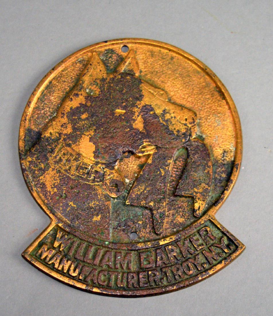 William Barker Cuffs & Collars metal advertising logo: Finish wear and discoloration