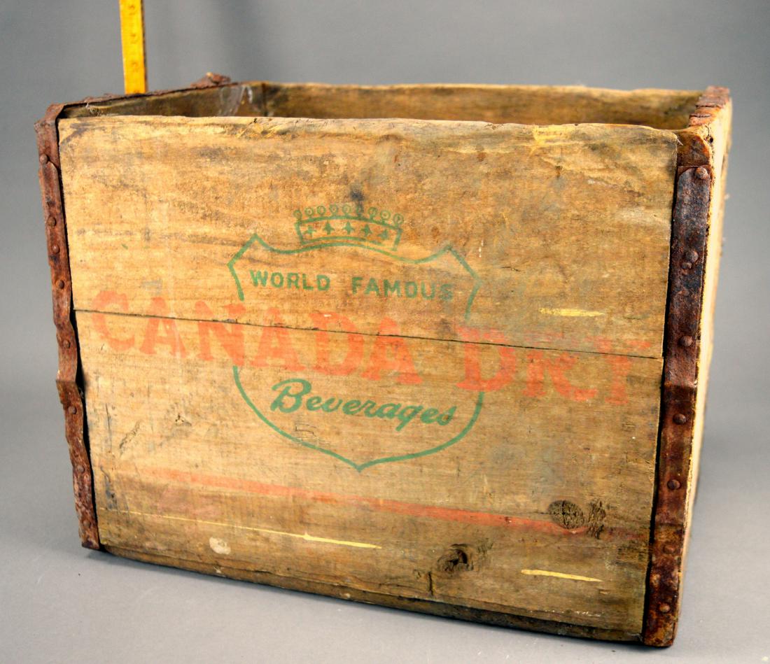 Canada Dry Crate: Wear, fading, and stains. Rust and missing piece to metal straps