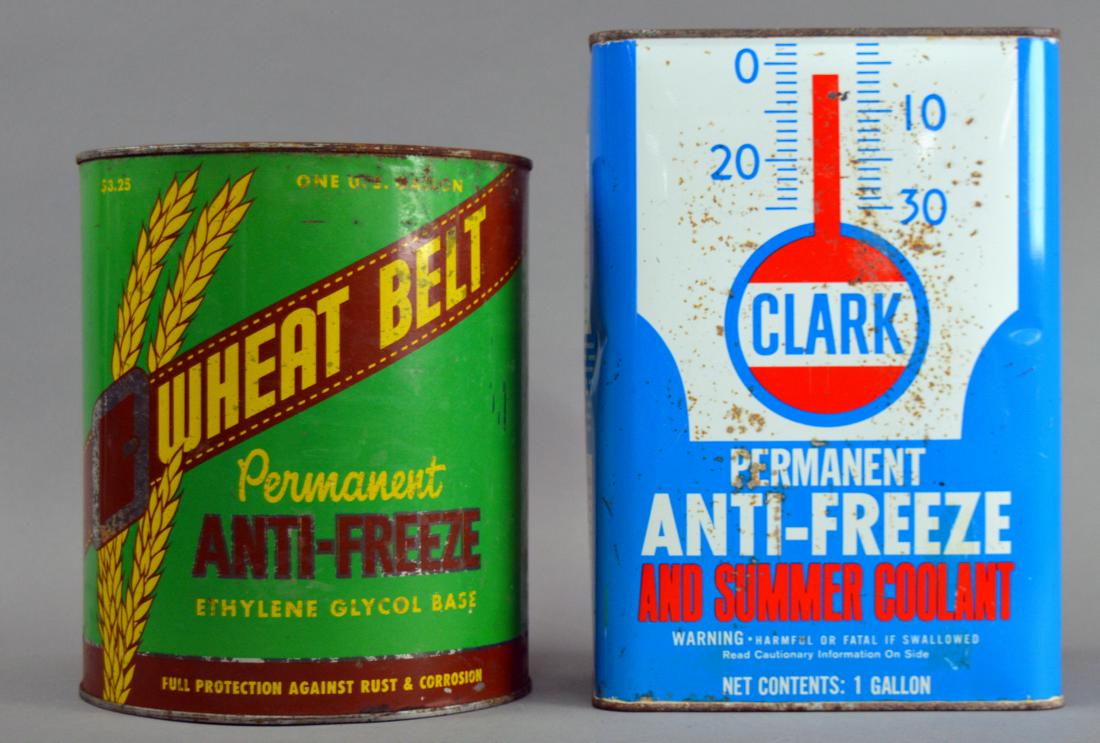 Two vintage anti-freeze cans: Including Wheat Belt & Clark. WB missing top, rust and wear throughout