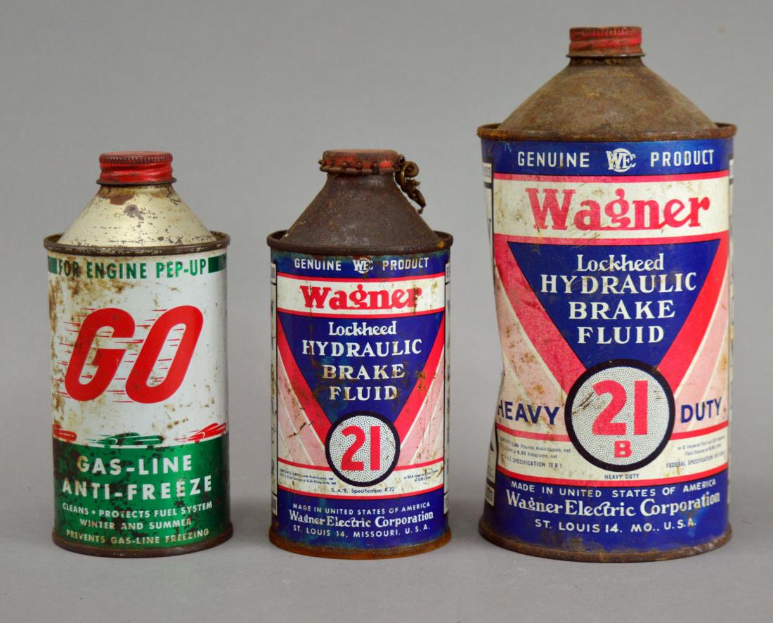 Three vintage cans: Wagner Brake Fluid & GO Anti-Freeze: Rust, dents, scratching, and wear.