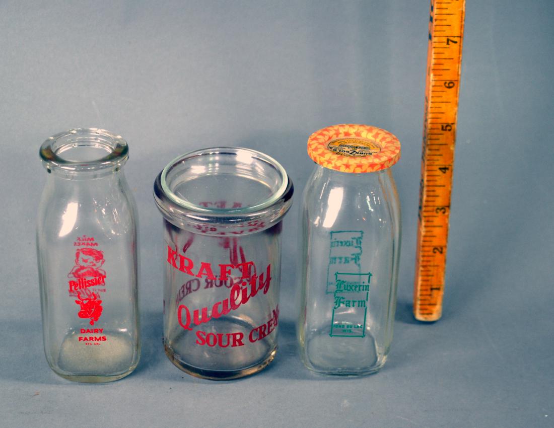 Three vintage dairy bottles: Kraft Sour Cream, Luxerin Farm, and Pellissier dair farms