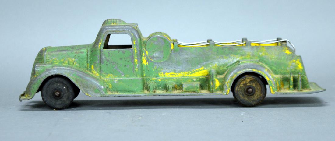 Vintage Metal Masters Co. toy fire truck (green): Surface and paint wear; missing parts