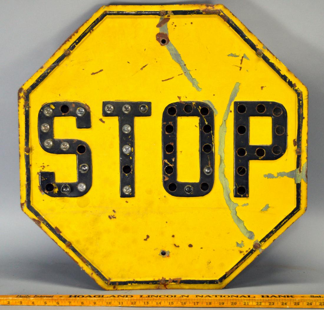 Yellow Stop Sign with Glass Reflectors: Missing reflectors, sign seperated