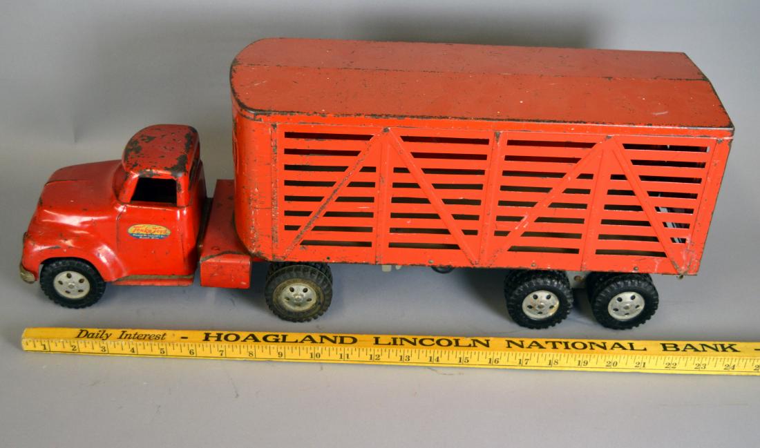 Tonka Toys red cattle truck: Surface wear throughout. Trailer with wood bottom