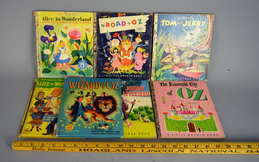 Seven children's books including Little Golden: Wear throughout. Titles include "The Wizard of Oz," The Emerald City of Oz," "Alice in Wonderland," Tom & Jerry," The Road to Oz," and "Johnny Appleseed"