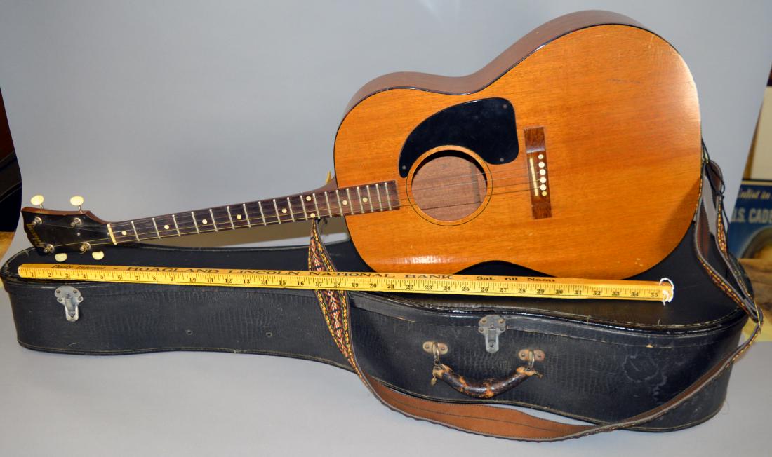 Gibson TG-0 acoustic guitar: Wear commensurate with age and use. With case. Does have some scuffing.