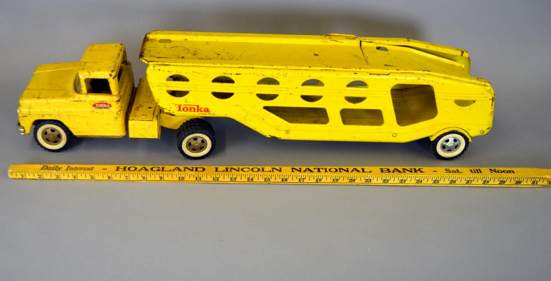 Tonka yellow car hauler semi: Rust and surface wear