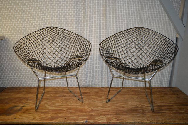 Pair Mid Century Harry Bertoia Diamond Chairs: Minor wear and scratching throughout, with some retouched scratches. 33" high x 32.5" wide x 21" deep. Buyer must arrange pickup or third party shipping.