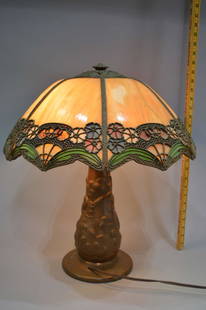 Bent Panel Slag Leaded Glass Table Lamp: A bent panel slag leaded glass table lamp, early 20th century. Two of the bent panels are cracked. Please review the images for condition and dimensions.